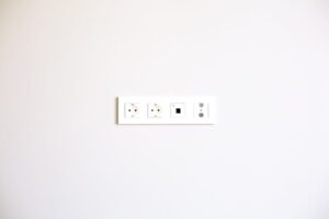 Modern wall outlet array installed on a bright white wall