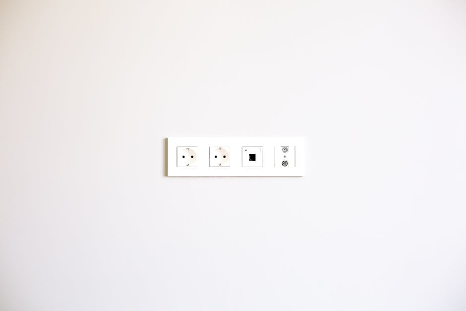 Modern wall outlet array installed on a bright white wall